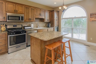 Large tile floor in kitchen. You will love this wi