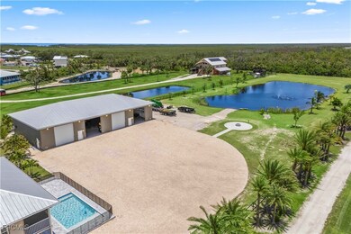 Sweeping aerial view of the home, detached garage,