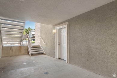 Below grade area with a textured ceiling