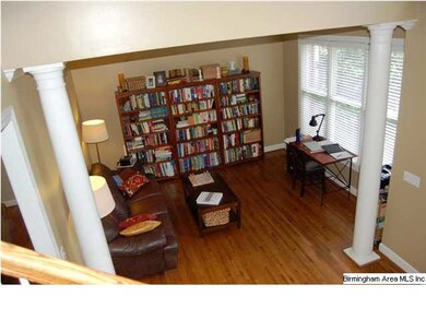 Columns separate living room from the foyer