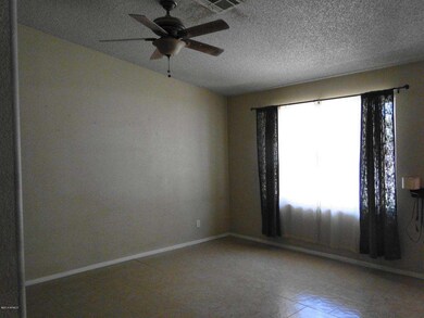 Sunken living room with tile floor