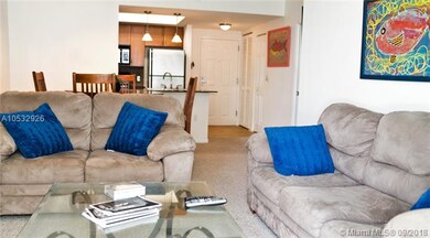 View from living room to dining area and kitchen.
