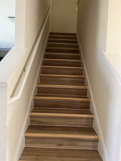 Staircase with wood finished floors