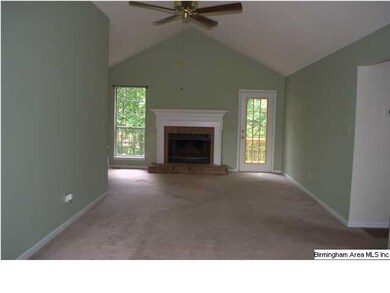 Family room with vaulted ceilings and wood burning