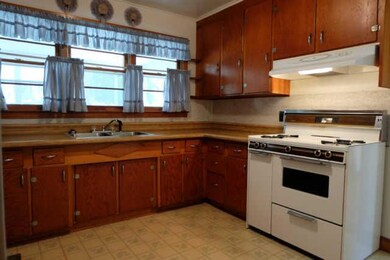 Kitchen with stove and refrigerator 