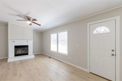 Foyer entrance with ornamental molding, ceiling fa