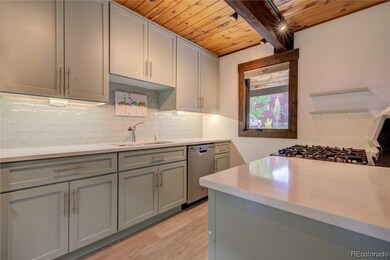Quartz counters, glass backsplash, new cabinets