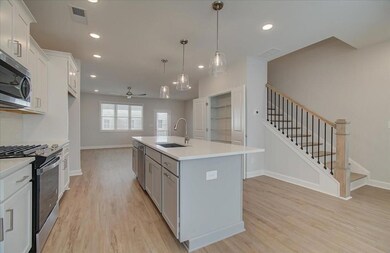 A nearly 10 foot long island allows for alot of prep space, buffet space or room for friends to hang out!