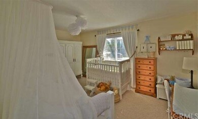 Large lower master bedroom is light & bright.
