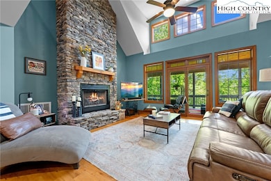 Living Room with Stacked Stone Natural Gas Firepla