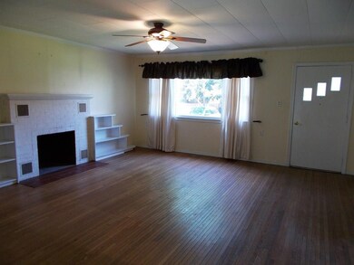 The livingroom is cheerful with   sunshine filling