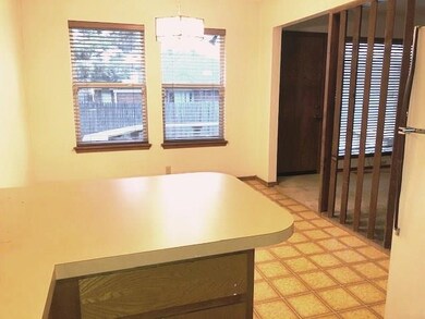 This view of the kitchen shows the entry from the 