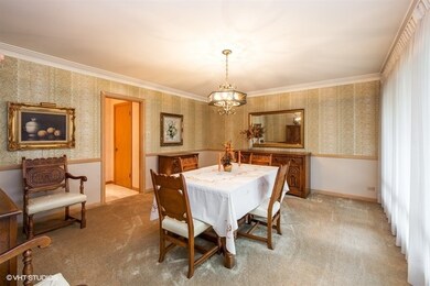 Large separate formal dining room with plaster cov