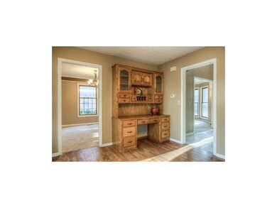 Hardwood floors and built in desk adorn the breakf