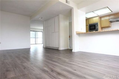 Family Room and Dining Area Next to the Open Kitch
