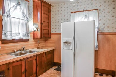 Kitchen has tall cabinets.