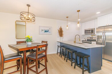 Interior space with sink, kitchen peninsula, light