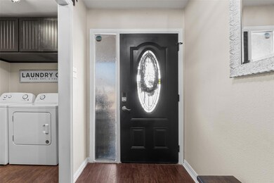 Foyer with independent washer and dryer and dark h