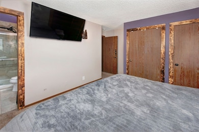Primary bedroom with ensuite bathroom