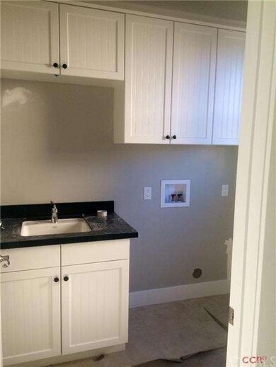 Laundry room with sink and hookups for gas dryer