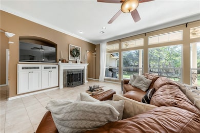 Living area with light tile patterned floors, a st