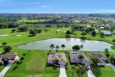 aerial of home from the front with lake and golf course view