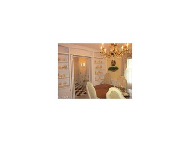 Large formal dining room with built-in shelves