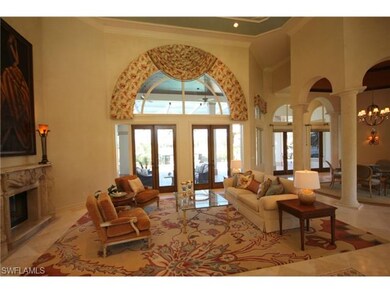 Formal Living Rm, fireplace and view of lanai.