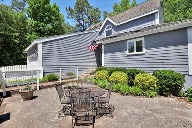 Front courtyard has a paver patio, and privacy fen