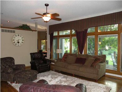 Great view of the large treed back yard~