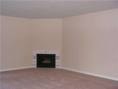 spacious living room with gas log fireplace