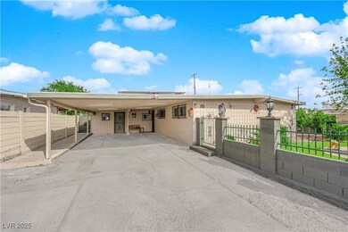 Single story home with driveway, concrete block si
