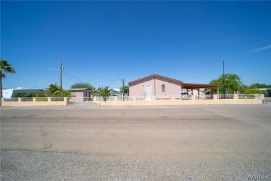 View of front of house featuring a carport