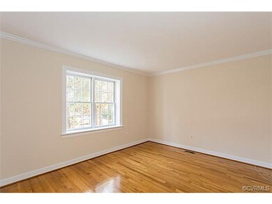 Living Room with pretty hardwood floors.  New pain