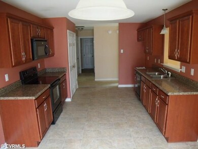 Kitchen - The kitchen is open and features a built