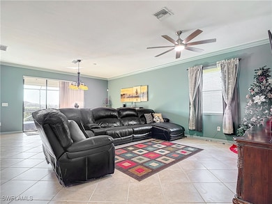Living area with light tile patterned floors, visi