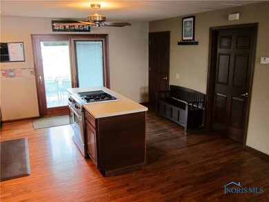 Kitchen island and sliding glass doors to stamped