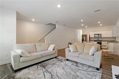 Living room featuring light hardwood / wood-style 
