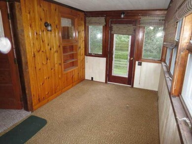 Porch - Enclosed. Enclosed porch located on the si