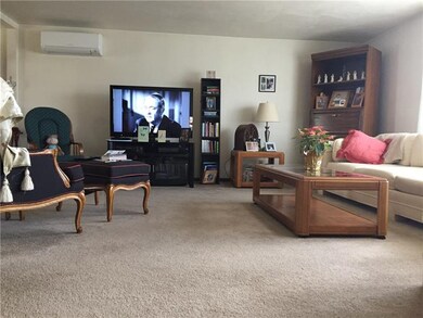 Spacious Living room is bright and airy with a Mit