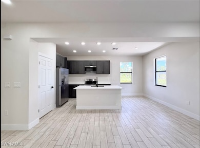 Kitchen with appliances with stainless steel finis