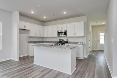 Kitchen featuring appliances with stainless steel 