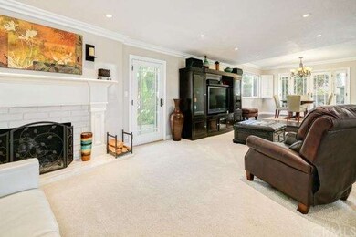 Living room with door leading to Patio, shed and g