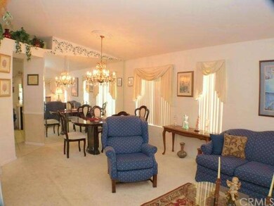 Formal dining room with mirrored wall and chandeli