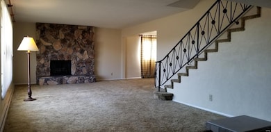 Wood burning fireplace, grand staircase and big picture window offer large area to customize and fit your needs.