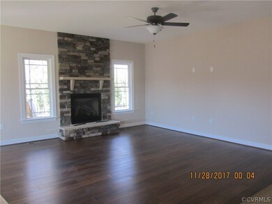 Family Room with gas fireplace, hardwood floors.