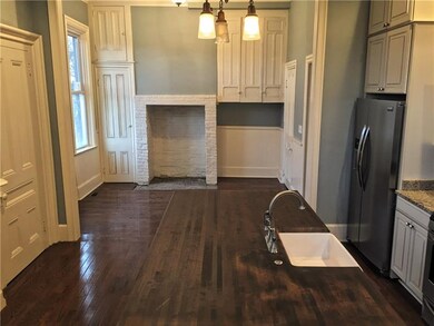 Original built-in cabinets anchor the eat-in secti
