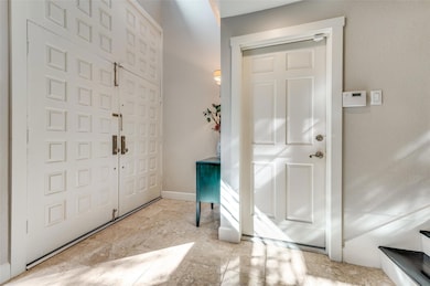 Entrance foyer featuring light tile patterned floo