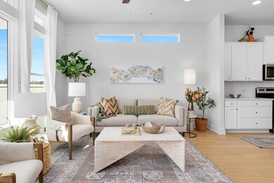 Living room featuring ceiling fan, recessed light