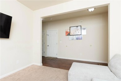 Unfurnished room featuring baseboards and dark col